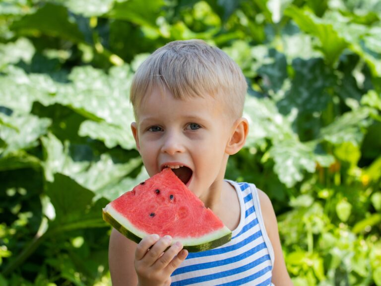 Age-Appropriate Milestones for 4 Year Olds 4 years old boy eating watermelon. Cute kid