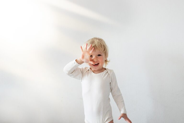 Age-appropriate milestones for 2 Year Olds Little girl 2 years old shows an open palm